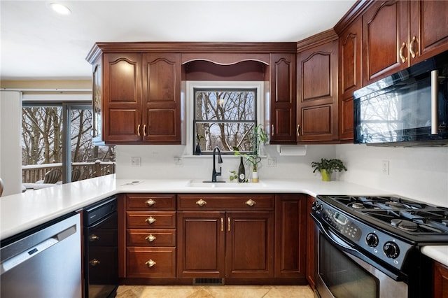 kitchen with sink, light tile patterned floors, and black appliances