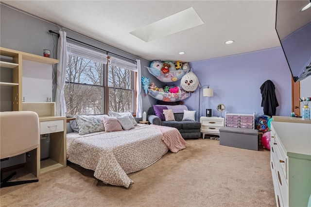 bedroom with light colored carpet and a skylight