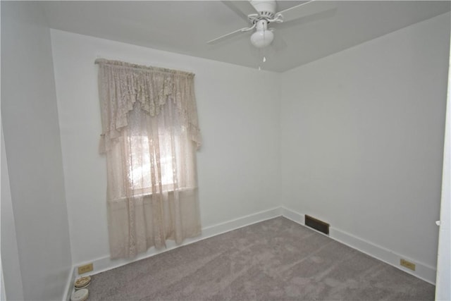 carpeted empty room with ceiling fan