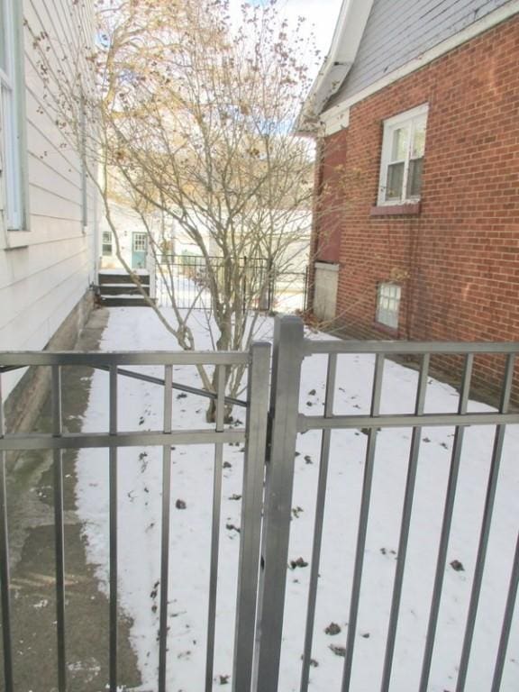 view of snow covered gate