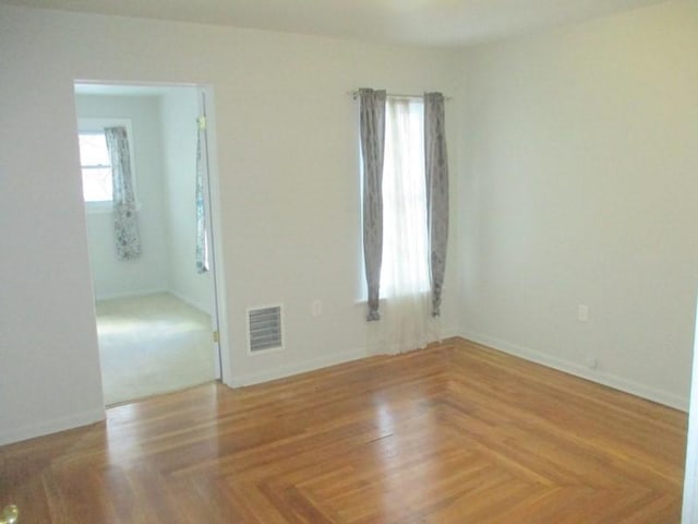 spare room with parquet floors