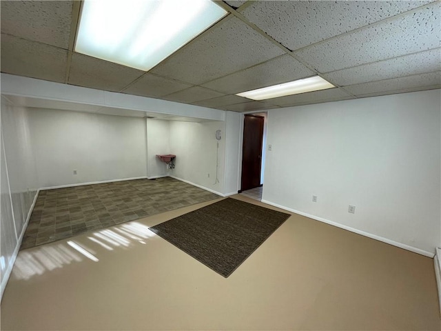 basement featuring a drop ceiling