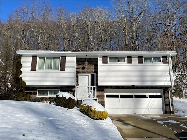 split foyer home featuring a garage