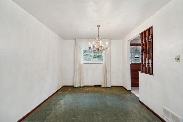 unfurnished dining area featuring an inviting chandelier, carpet flooring, visible vents, and baseboards