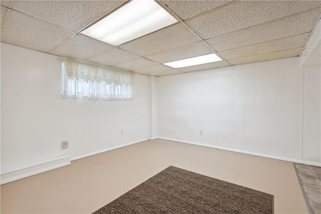 empty room featuring a drop ceiling