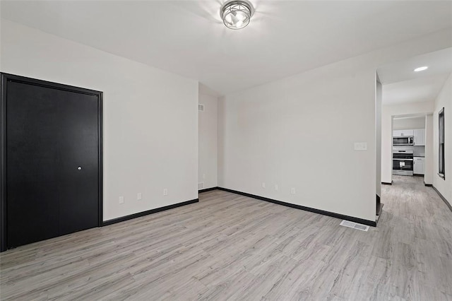 empty room featuring light hardwood / wood-style floors