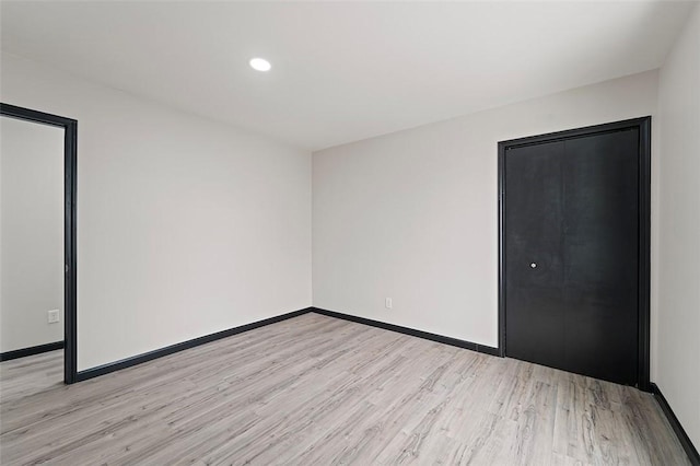 empty room with light wood-type flooring