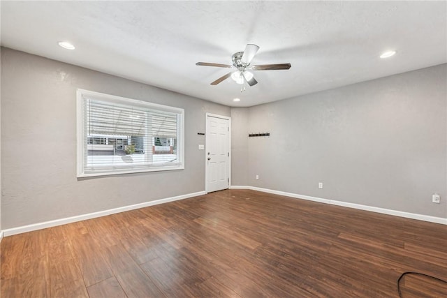 unfurnished room with ceiling fan and wood-type flooring