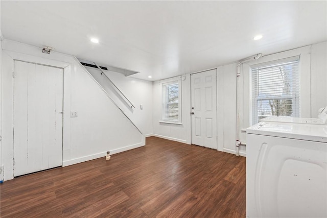 entrance foyer with washing machine and clothes dryer and dark hardwood / wood-style floors