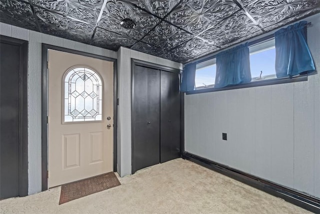 view of carpeted foyer