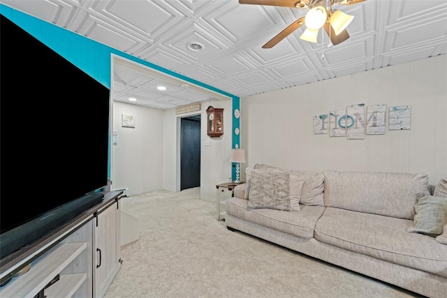 living room featuring ceiling fan and light colored carpet