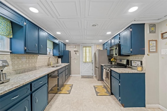 kitchen with stainless steel appliances, blue cabinets, and sink