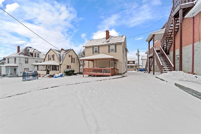 view of snow covered house