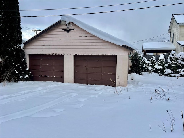 view of snow covered garage