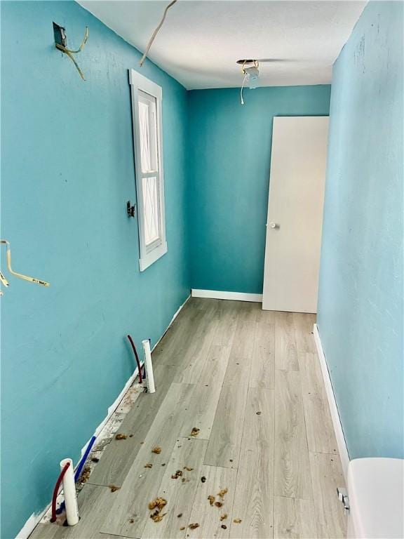 spare room featuring light hardwood / wood-style flooring