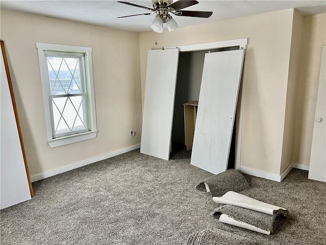 unfurnished bedroom featuring carpet flooring and ceiling fan