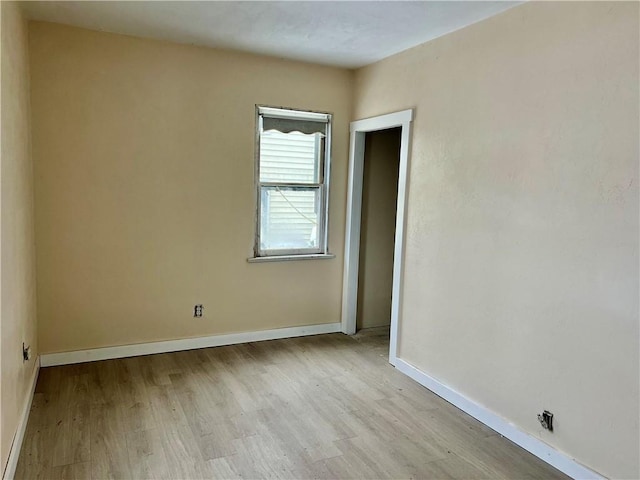 unfurnished room with light hardwood / wood-style flooring