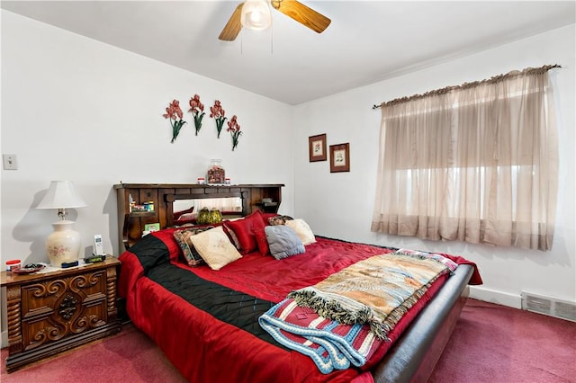 bedroom with ceiling fan and carpet floors