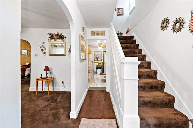 1405 Bellaire Pl, Brookline, PA 15226 - stairway with arched walkways, carpet, and a ceiling fan