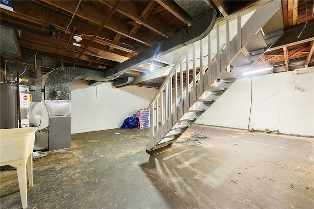 basement featuring heating unit and gas water heater