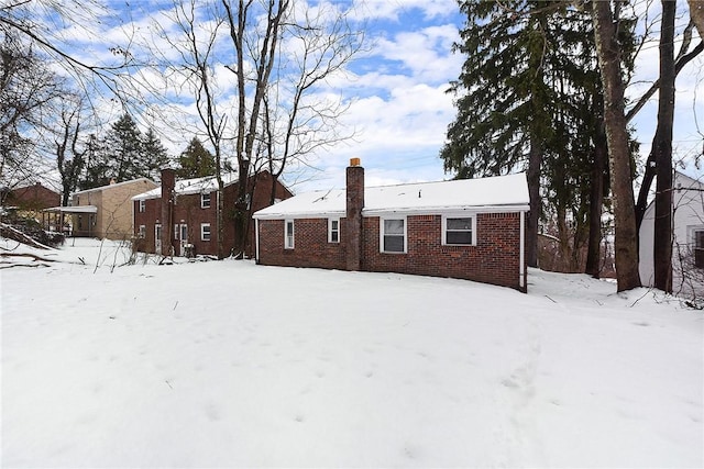 view of snow covered house