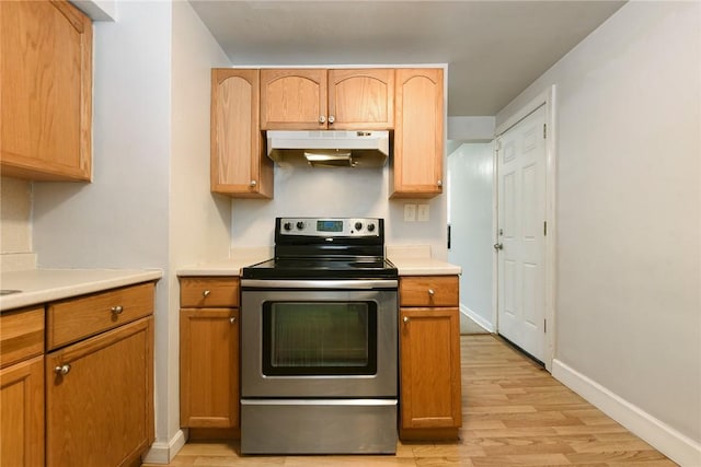 kitchen featuring light hardwood / wood-style flooring and stainless steel electric range