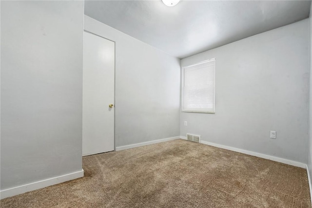 spare room with carpet floors