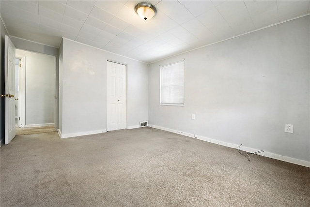 spare room featuring carpet flooring