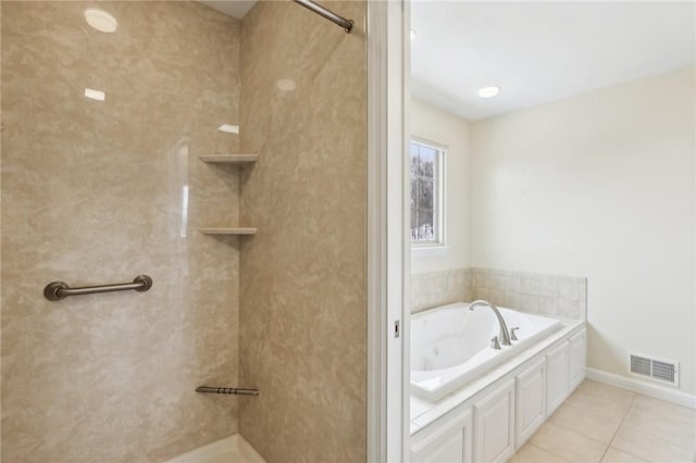 bathroom featuring a bathing tub and tile patterned floors