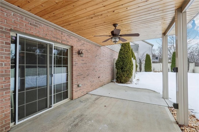 snow covered patio with ceiling fan