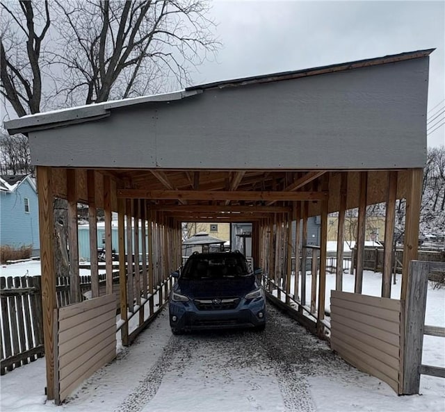 view of snow covered parking