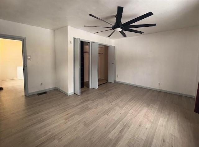 interior space with ceiling fan and light wood-type flooring