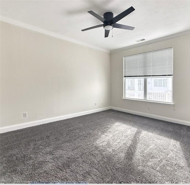 carpeted spare room featuring ceiling fan and crown molding