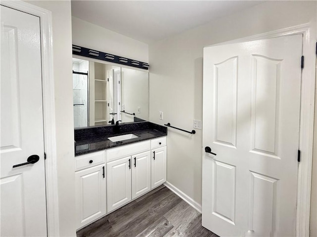 bathroom featuring hardwood / wood-style floors and vanity