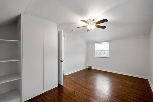 additional living space featuring ceiling fan, built in features, dark wood-type flooring, and lofted ceiling