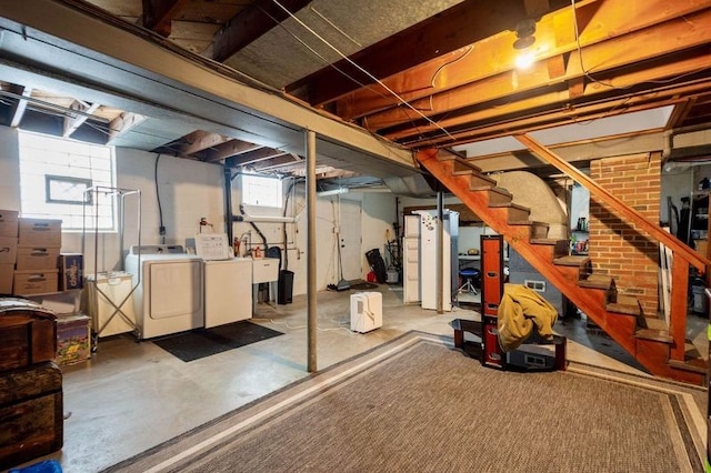 basement featuring plenty of natural light and independent washer and dryer