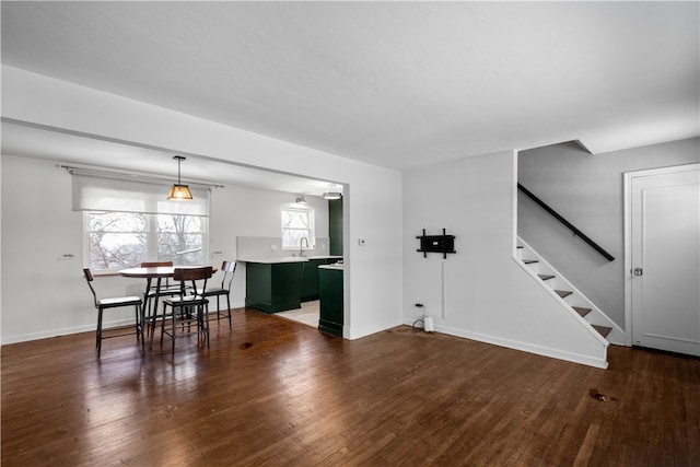 living room with dark hardwood / wood-style flooring and sink