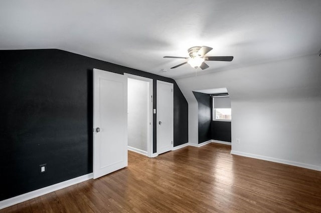 bonus room with ceiling fan, wood-type flooring, and vaulted ceiling