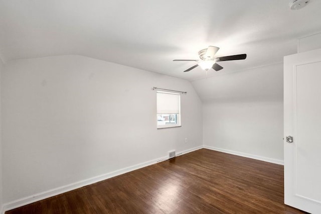 bonus room with dark hardwood / wood-style flooring, vaulted ceiling, and ceiling fan