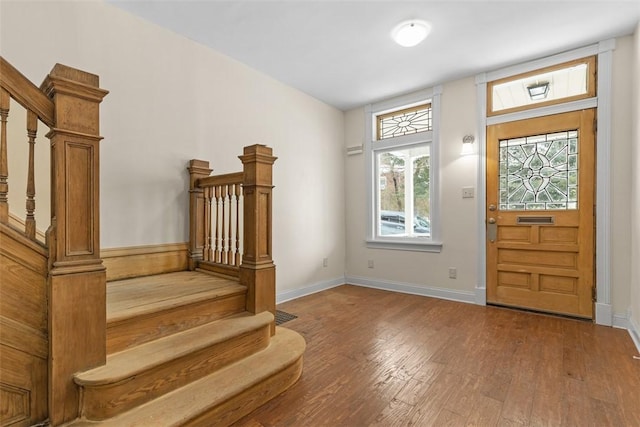 entryway with hardwood / wood-style floors