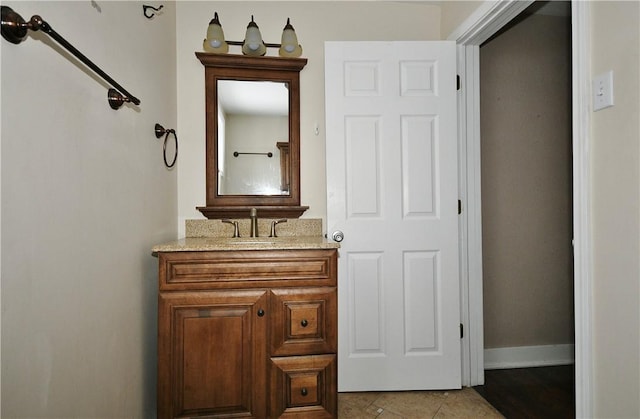 bathroom with tile patterned floors and vanity