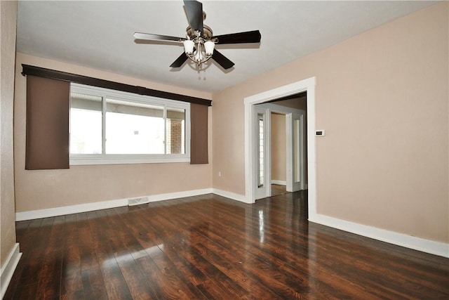 spare room featuring dark hardwood / wood-style floors and ceiling fan