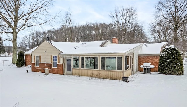 view of snow covered house