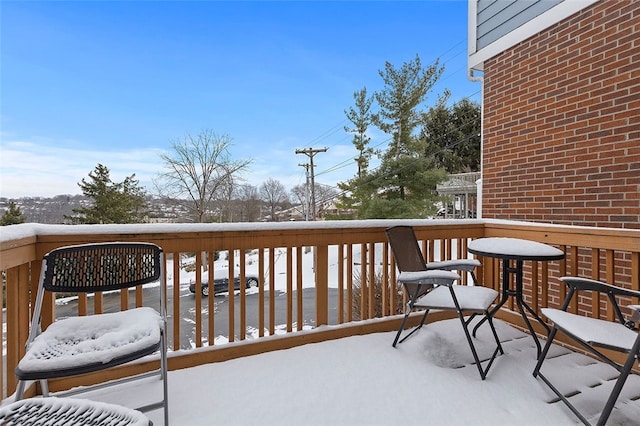 view of snow covered deck