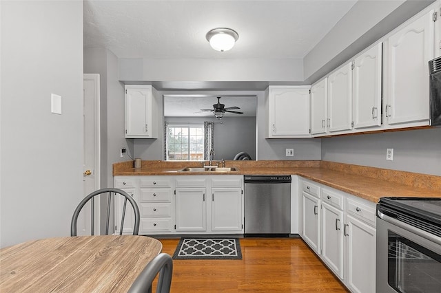 kitchen with white cabinetry, sink, ceiling fan, and appliances with stainless steel finishes