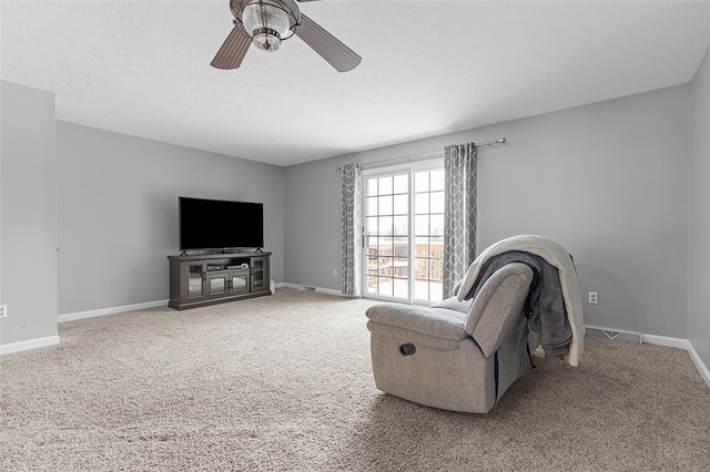 living room with carpet floors and ceiling fan