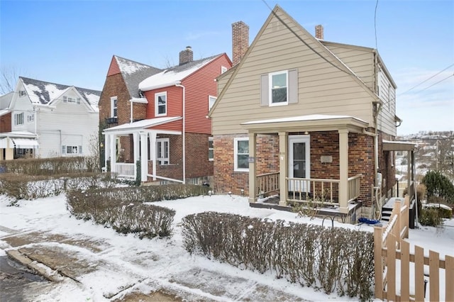 view of snow covered house