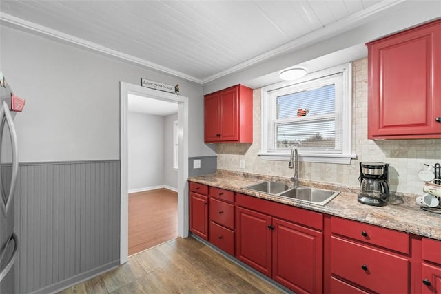 kitchen featuring sink, wooden ceiling, light stone counters, dark hardwood / wood-style flooring, and ornamental molding