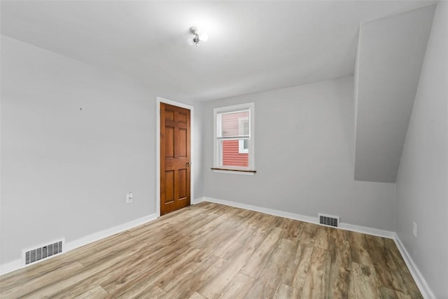 spare room featuring light hardwood / wood-style flooring