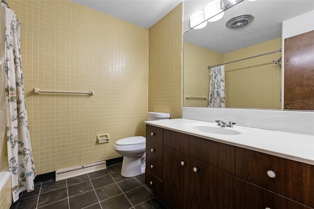 full bathroom featuring vanity, shower / bath combo, toilet, tile walls, and a baseboard radiator